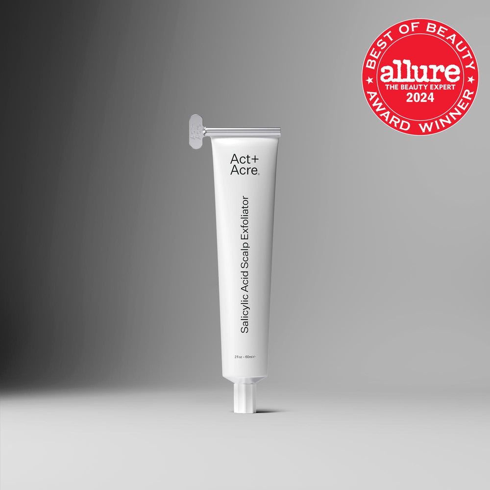 Tube of Act+Acre Salicylic Acid Scalp Exfoliator with Allure Best of Beauty Award badge on a gray background