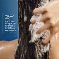 Person washing hair with soapy hands, showing expected results from Act+Acre Daily Hydro™ Shampoo.