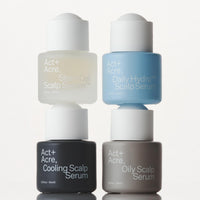 Four bottles of Act+Acre scalp serum in different colors on a white background