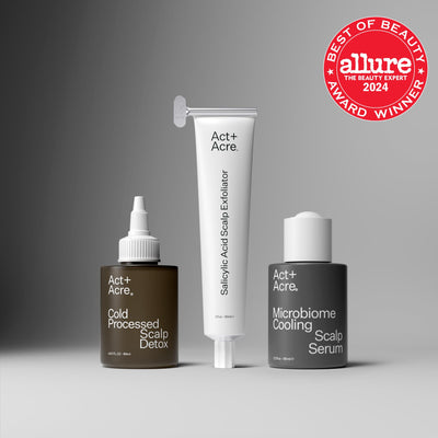 Three scalp care products from Act+Acre with an Allure Best of Beauty 2024 award badge on a gray background.