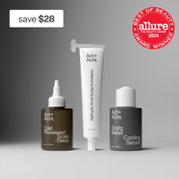 Three Act+Acre. scalp care products on a gray studio background: a brown bottle labeled Cold Processed Scalp Detox, a white tube labeled Salicylic Acid Scalp Exfoliator, and a dark gray bottle labeled Scalp Relief Cooling Serum.