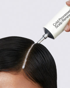 Photo of person applying Scalp Renew on hairline