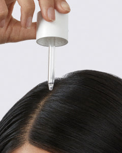 Photo of person applying product to scalp