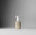 Haircare bottle with pump on a gradient gray background